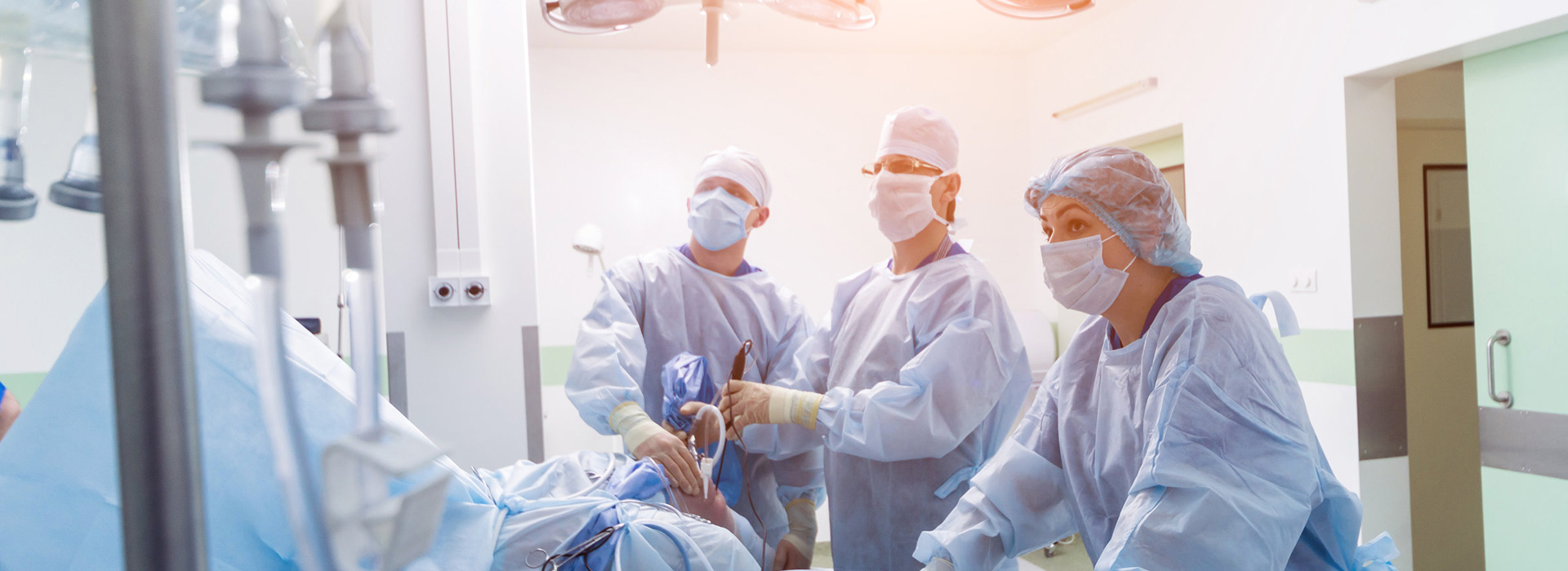 Pic of Surgical Team in Operating Room Performing Procedure on Omega Medical Solutions About Page
